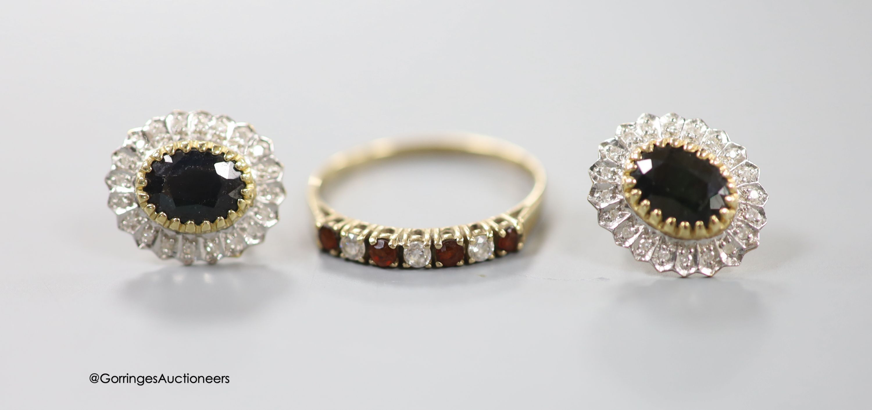 A pair of 9ct, sapphire and diamond set oval earrings (no butterflies), a pair of yellow metal and diamond set earrings(adapted), one other pair, a modern 9ct mounted oval cameo shell brooch and a 9ct gold and CZ ring